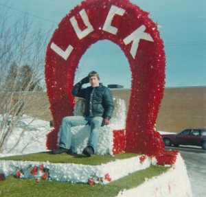 1979 - Paul posing on Luck Winter Carnival float in wintertime