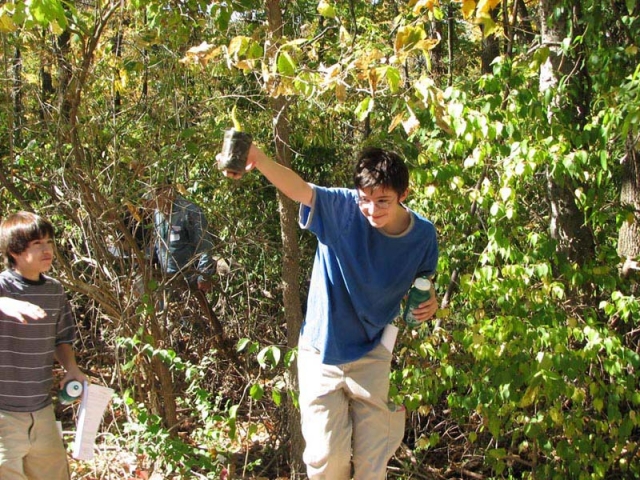 2006 - Kids finding a geocache during a field trip after a SLAGA geocaching training class at Thomas Jefferson High School in Sunset Hills, Missouri.