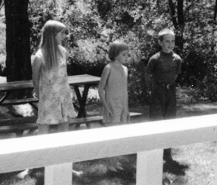 1970-ish - Skit program on front yard of Walt Konopacki home. Barb Konopacki, Julie Henriksen, Paul Konopacki performing for audience sitting on porch.